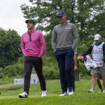 
              Rory McIlroy (left) of Northern Ireland and Justin Thomas of the USA walk down the 9th fairway during the first round of the Canadian Open in Toronto on Thursday, June 9, 2022. (Frank Gunn/The Canadian Press via AP)
            