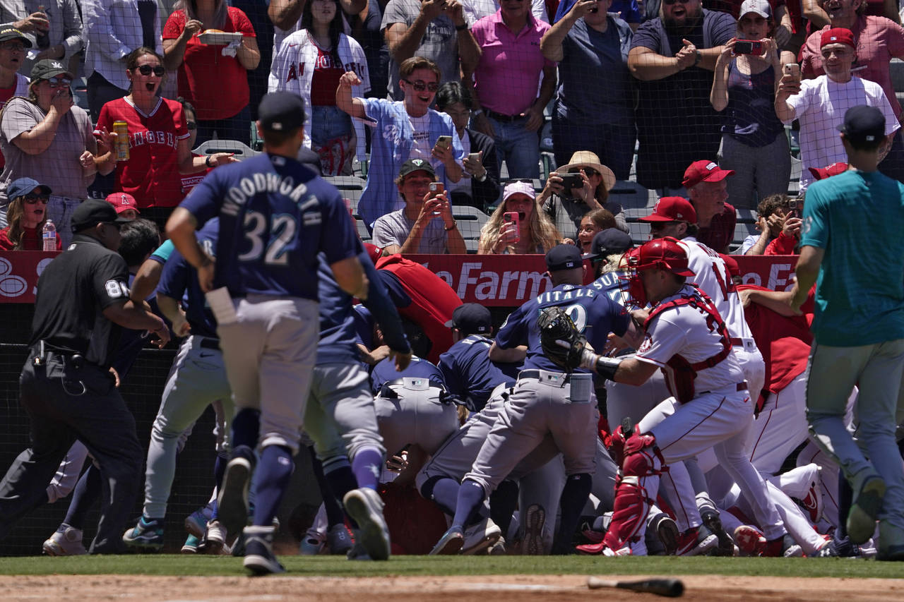 Several members of the Seattle Mariners and the Los Angeles Angels scuffle after Mariners' Jesse Wi...