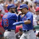 
              Chicago Cubs' David Bote (13) and Rafael Ortega celebrate after scoring during the fourth inning of a baseball game against the St. Louis Cardinals Sunday, June 26, 2022, in St. Louis. (AP Photo/Jeff Roberson)
            