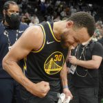 
              Golden State Warriors guard Stephen Curry (30) reacts after beating the Boston Celtics in Game 4 of basketball's NBA Finals, Friday, June 10, 2022, in Boston. (AP Photo/Steven Senne)
            