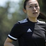 
              Japanese referee Yoshimi Yamashita warms up during a training session Monday, June 27, 2022, at JFA YUME Field in Chiba, near Tokyo. Yamashita is one three three women picked in a pool of 36 head referees for the men's World Cup in Qatar, which opens in just under five months on Nov. 21. It's the first time a female will be in charge on soccer largest stage. (AP Photo/Eugene Hoshiko)
            