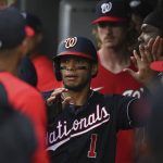 
              Washington Nationals' Cesar Hernandez (1) high fives teammates after scoring during the first inning of a baseball game against the Baltimore Orioles, Tuesday, June 21, 2022, in Baltimore. (AP Photo/Tommy Gilligan)
            