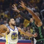 
              Golden State Warriors guard Stephen Curry (30) shoots against Boston Celtics center Al Horford during the first half of Game 5 of basketball's NBA Finals in San Francisco, Monday, June 13, 2022. (AP Photo/Jed Jacobsohn)
            
