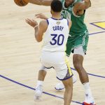 
              Golden State Warriors guard Stephen Curry (30) is defended by Boston Celtics center Al Horford during the second half of Game 1 of basketball's NBA Finals in San Francisco, Thursday, June 2, 2022. (AP Photo/John Hefti)
            