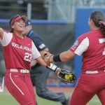 
              Oklahoma's Tiare Jennings (23) and Hope Trautwein (7) celebrate after defeating UCLA in an NCAA softball Women's College World Series elimination game on Monday, June 6, 2022, in Oklahoma City. (AP Photo/Alonzo Adams)
            