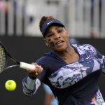
              Serena Williams of the United States returns the ball during their doubles tennis match with Ons Jabeur of Tunisia against Marie Bouzkova of Czech Republic and Sara Sorribes Tormo of Spain at the Eastbourne International tennis tournament in Eastbourne, England, Tuesday, June 21, 2022. (AP Photo/Kirsty Wigglesworth)
            