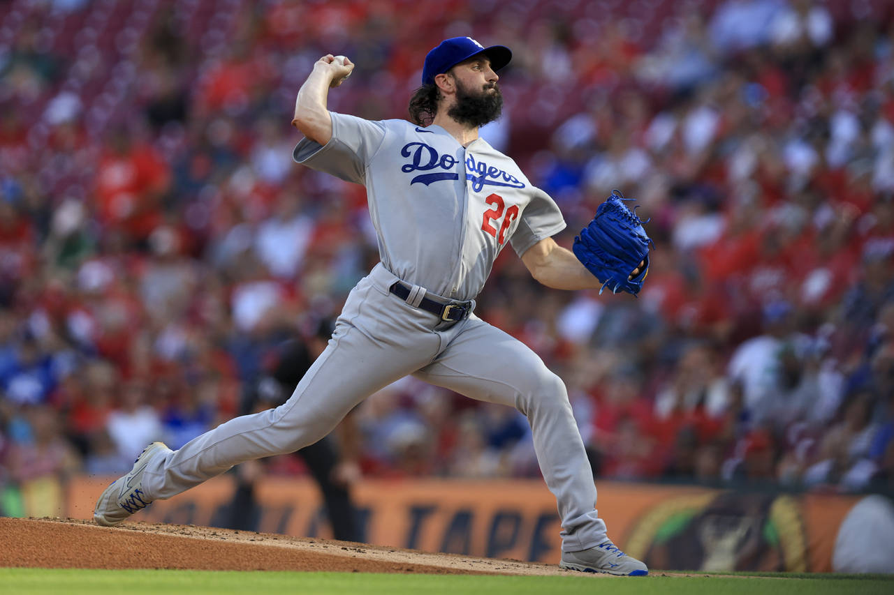 Los Angeles Dodgers' Tony Gonsolin throws during the first inning of a baseball game against the Ci...