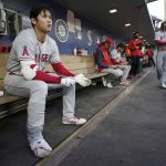 
              Los Angeles Angels' Shohei Ohtani sits in the dugout before batting during the fifth inning of the team's baseball game against the Seattle Mariners, Thursday, June 16, 2022, in Seattle. (AP Photo/Ted S. Warren)
            