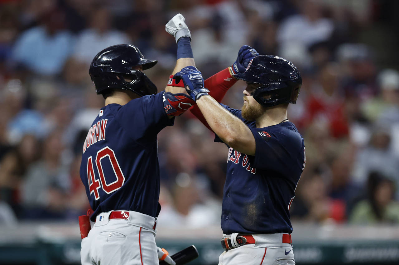Boston Red Sox's Christian Arroyo, right, celebrates with Jarren Duran after hitting a two-run home...