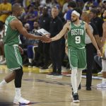 
              Boston Celtics center Al Horford, left, celebrates with guard Derrick White (9) during the second half of Game 1 of basketball's NBA Finals against the Golden State Warriors in San Francisco, Thursday, June 2, 2022. (AP Photo/Jed Jacobsohn)
            