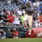 
              Washington Nationals' Juan Soto, right, celebrates his two-run home run with third base coach Gary Disarcina (10) as he rounds the bases during the fifth inning of a baseball game against the Milwaukee Brewers, Saturday, June 11, 2022, in Washington. (AP Photo/Nick Wass)
            