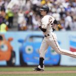 
              San Francisco Giants' Mike Yastrzemski rounds the bases after hitting a home run against the Los Angeles Dodgers during the first inning of a baseball game in San Francisco, Sunday, June 12, 2022. (AP Photo/Jeff Chiu)
            