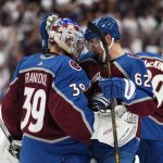 
              Colorado Avalanche left wing Artturi Lehkonen (62) celebrates the team's 4-0 win against the Edmonton Oilers with goaltender Pavel Francouz (39) following Game 2 of the NHL hockey Stanley Cup playoffs Western Conference finals Thursday, June 2, 2022, in Denver. (AP Photo/Jack Dempsey)
            