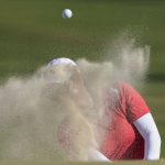
              Mina Harigae hits out of a bunker on the 14th hole during the final round of the U.S. Women's Open golf tournament at the Pine Needles Lodge & Golf Club in Southern Pines, N.C., on Sunday, June 5, 2022. (AP Photo/Chris Carlson)
            