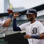 
              Detroit Tigers' Willi Castro, right, is greeted at the dugout by teammate Miguel Cabrera after scoring on Jonathan Schoop's single to center during the first inning of a baseball game against the Minnesota Twins, Wednesday, June 1, 2022, in Detroit. (AP Photo/Carlos Osorio)
            