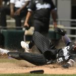 
              Chicago White Sox's Josh Harrison slides safely into home plate on a Luis Robert single during the sixth inning of a baseball game against the Toronto Blue Jays Wednesday, June 22, 2022, in Chicago. (AP Photo/Paul Beaty)
            
