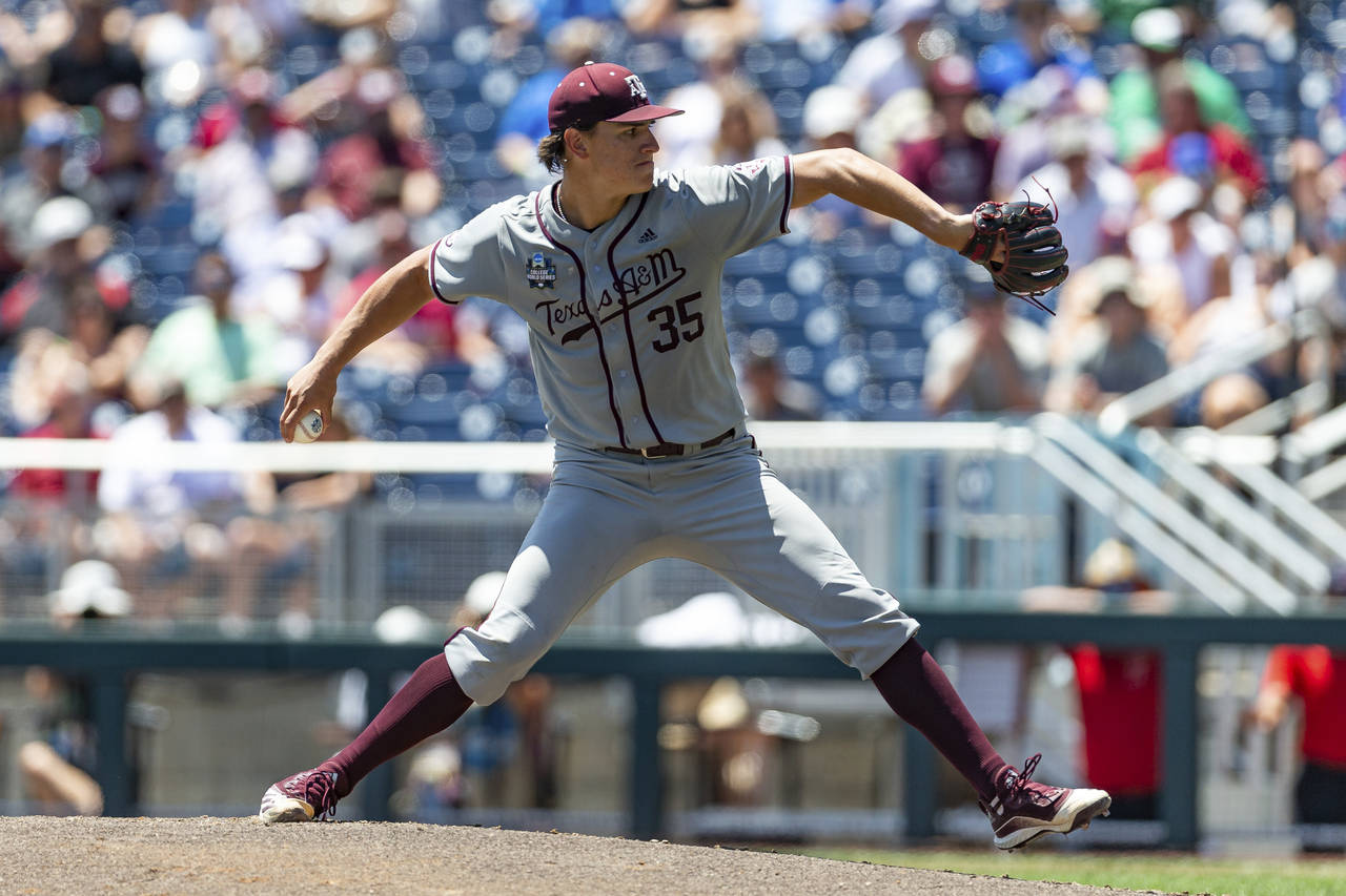Texas A&M starting pitcher Nathan Dettmer (35) throws a pitch against Notre Dame in the first innin...