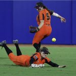 
              Oregon State outfielders Eliana Gottlieb (12) and Kaylah Nelson (5) miss an Arizona hit to the outfield during the second inning of an NCAA softball Women's College World Series game Friday, June 3, 2022, in Oklahoma City. (AP Photo/Alonzo Adams)
            