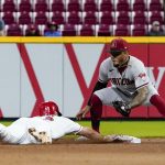 
              Arizona Diamondbacks second baseman Ketel Marte, right, attempts to tag out Cincinnati Reds' Brandon Drury, left, on a pickoff-attempt during the seventh inning of a baseball game Monday, June 6, 2022, in Cincinnati. (AP Photo/Jeff Dean)
            
