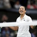 
              France's Harmony Tan celebrates after beating Serena Williams of the US in a first round women’s singles match on day two of the Wimbledon tennis championships in London, Tuesday, June 28, 2022. (John Walton/PA via AP)
            