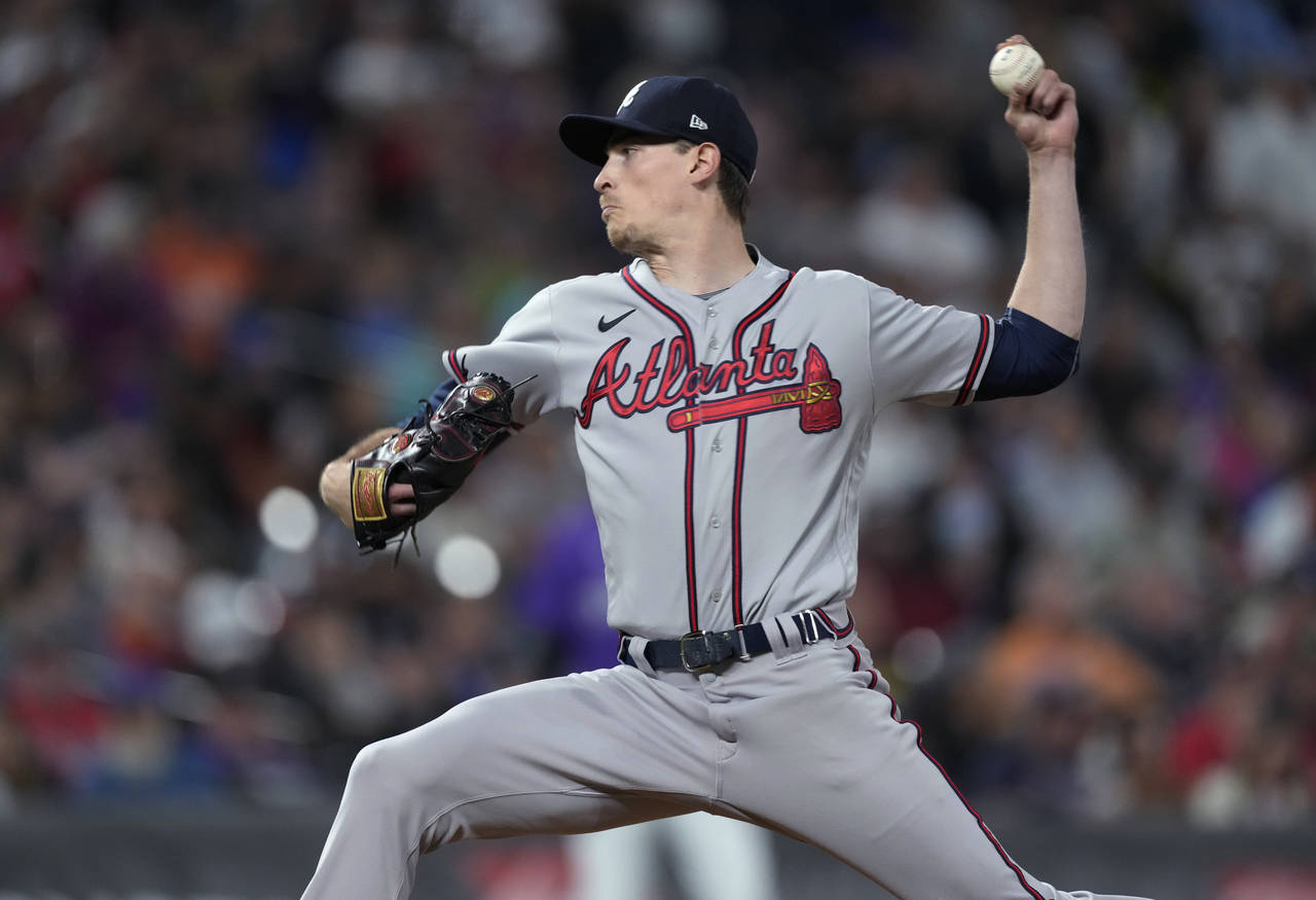 Atlanta Braves starting pitcher Max Fried works against the Colorado Rockies during the eighth inni...