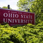 
              FILE - This May 8, 2019, photo, shows a sign for The Ohio State University in Columbus, Ohio. Ohio State University has won its fight to trademark the word "The." The U.S. Patent and Trademark Office approved the university's request Tuesday, June 21, 2022. The school says it allows Ohio State to control use of "The" on branded products associated with and sold through athletics and collegiate channels. (AP Photo/Angie Wang, File)
            