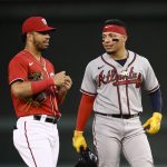 
              Atlanta Braves' William Contreras, right, talks with Washington Nationals shortstop Luis Garcia, left, during the fourth inning of a baseball game, Wednesday, June 15, 2022, in Washington. (AP Photo/Nick Wass)
            