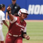 
              Oklahoma utility Jocelyn Alo (78) celebrates on the way to home plate after hitting a home run during the first inning of an NCAA Women's College World Series softball game against Texas on Saturday, June 4, 2022, in Oklahoma City. (AP Photo/Alonzo Adams)
            