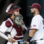 
              Stanford pitcher Alex Williams, right, talks to catcher Kody Huff during the second inning of an NCAA college baseball tournament super regional game against Connecticut on Saturday, June 11, 2022, in Stanford, Calif. (AP Photo/John Hefti)
            