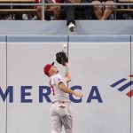 
              Los Angeles Angels center fielder Mike Trout makes a catch on a ball hit by Los Angeles Dodgers' Gavin Lux during the third inning of a baseball game Tuesday, June 14, 2022, in Los Angeles. (AP Photo/Mark J. Terrill)
            