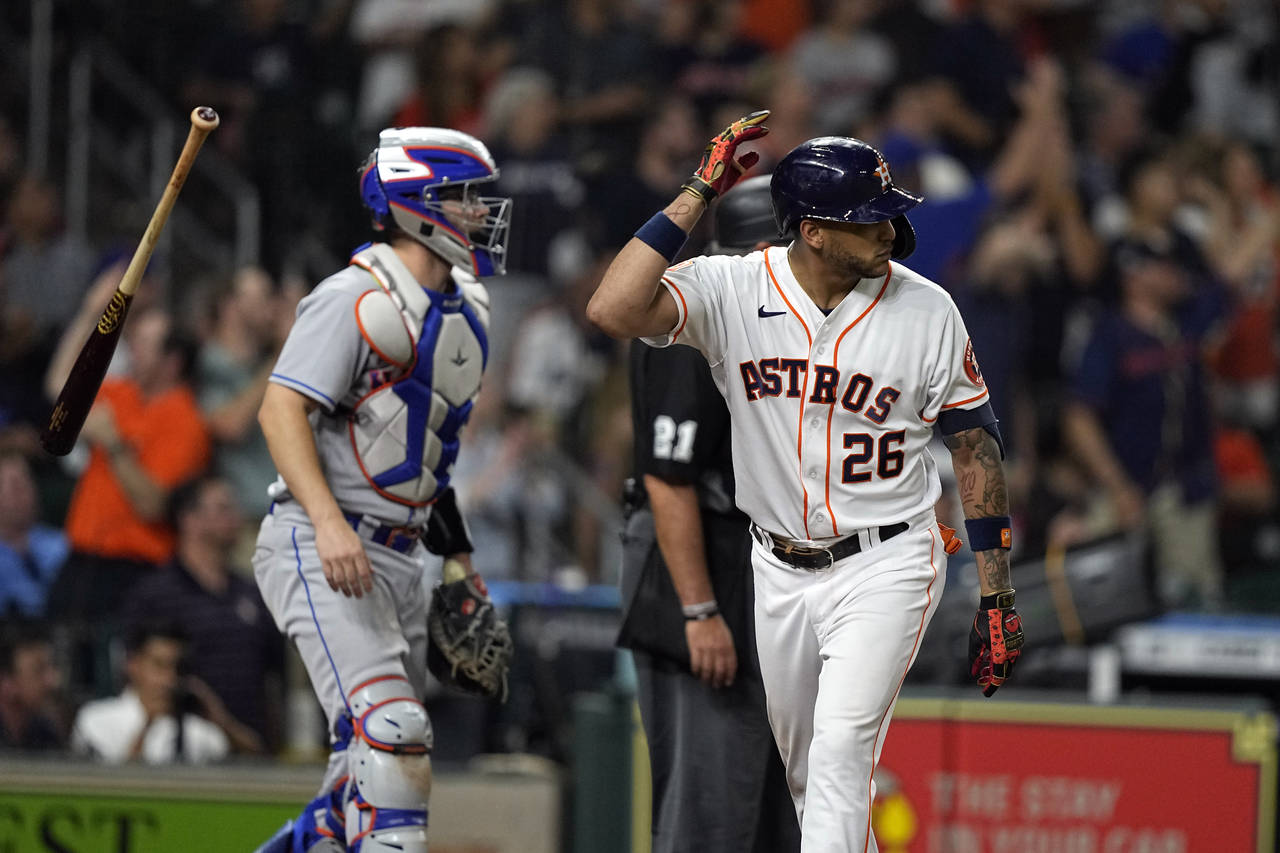 Houston Astros' Jose Siri (26) flips his bat after hitting a home run as New York Mets catcher Patr...