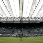 
              A retractable roof covers Court 1 during a rainfall on day one of the Wimbledon tennis championships in London, Monday, June 27, 2022. (AP Photo/Alberto Pezzali)
            