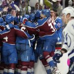 
              The Colorado Avalanche celebrate after an overtime goal by Andre Burakovsky in Game 1 of the NHL hockey Stanley Cup Final against the Tampa Bay Lightning on Wednesday, June 15, 2022, in Denver. (AP Photo/John Locher )
            