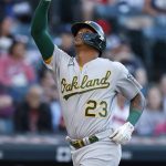 
              Oakland Athletics' Christian Bethancourt celebrates while running the bases after hitting a two-run home run against the Cleveland Guardians during the second inning of a baseball game Thursday, June 9, 2022, in Cleveland. (AP Photo/Ron Schwane)
            