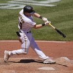 
              Pittsburgh Pirates' Tyler Heineman hits an RBI single off Chicago Cubs starting pitcher Justin Steele in the sixth inning of a baseball game in Pittsburgh, Thursday, June 23, 2022. (AP Photo/Gene J. Puskar)
            