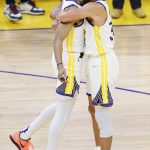 
              CORRECTS TO GAME 2 INSTEAD OF GAME 1- Golden State Warriors guard Jordan Poole, left, is congratulated by guard Stephen Curry after scoring against the Boston Celtics during the second half of Game 2 of basketball's NBA Finals in San Francisco, Sunday, June 5, 2022. (AP Photo/John Hefti)
            