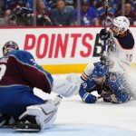 
              Edmonton Oilers center Derek Ryan (10) and Colorado Avalanche center Alex Newhook (18) tangle during the third period in Game 2 of the NHL hockey Stanley Cup playoffs Western Conference finals Thursday, June 2, 2022, in Denver. (AP Photo/Jack Dempsey)
            