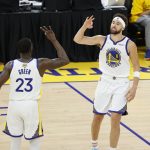 
              Golden State Warriors guard Klay Thompson (11) celebrates with forward Draymond Green (23) during the second half of Game 1 of basketball's NBA Finals against the Boston Celtics in San Francisco, Sunday, June 5, 2022. (AP Photo/John Hefti)
            