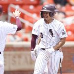 
              Missouri State's Drake Baldwin, right, smiles while celebrating with Hayden Moore (14) after hitting a home run  against Oklahoma State during an NCAA college baseball tournament regional game Sunday, June 5, 2022, in Stillwater, Okla. (Ian Maule/Tulsa World via AP)
            