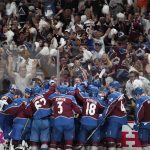 
              The Colorado Avalanche celebrate after an overtime win over the Tampa Bay Lightning in Game 1 of the NHL hockey Stanley Cup Final on Wednesday, June 15, 2022, in Denver. (AP Photo/John Locher)
            