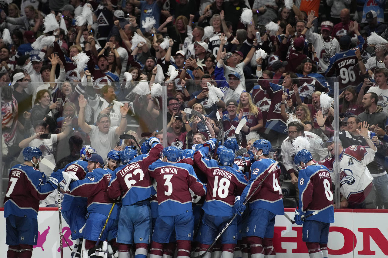 The Colorado Avalanche celebrate after an overtime win over the Tampa Bay Lightning in Game 1 of th...
