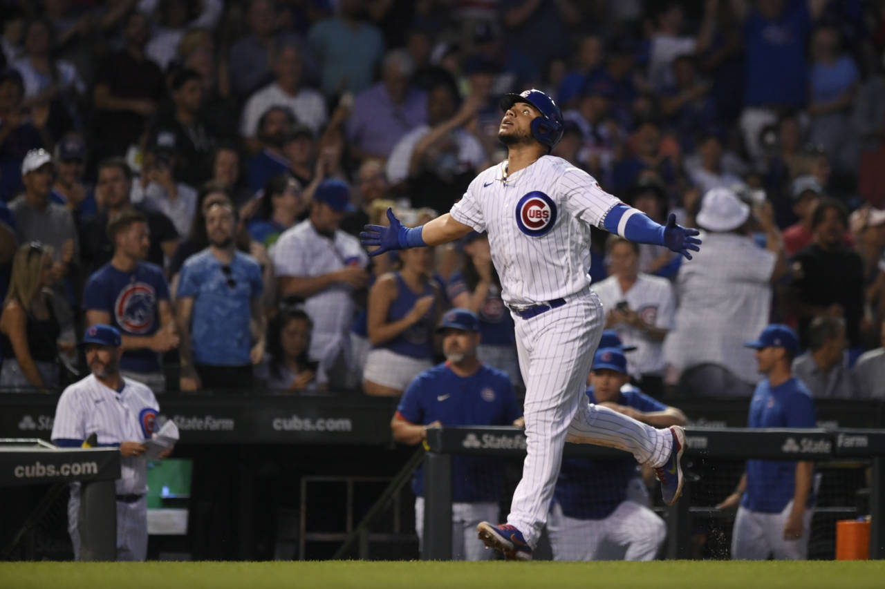 Chicago Cubs' Willson Contreras celebrates while running the bases after hitting a two-run home run...