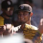 
              San Diego Padres starting pitcher Yu Darvish is congratulated by teammates in the dugout in the sixth inning of a baseball game against the Philadelphia Phillies, Sunday, June 26, 2022, in San Diego. (AP Photo/Derrick Tuskan)
            