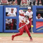 
              Oklahoma's Tiare Jennings (23) swings in the third inning of an NCAA softball Women's College World Series game against Northwestern on Thursday, June 2, 2022, in Oklahoma City. (AP Photo/Alonzo Adams)
            