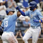 
              Kansas City Royals' Bobby Witt Jr. (7) celebrates with Salvador Perez (13) after hitting a home run during the seventh inning of a baseball game against thee Baltimore Orioles in Kansas City, Mo., Sunday, June 12, 2022. (AP Photo/Colin E. Braley)
            