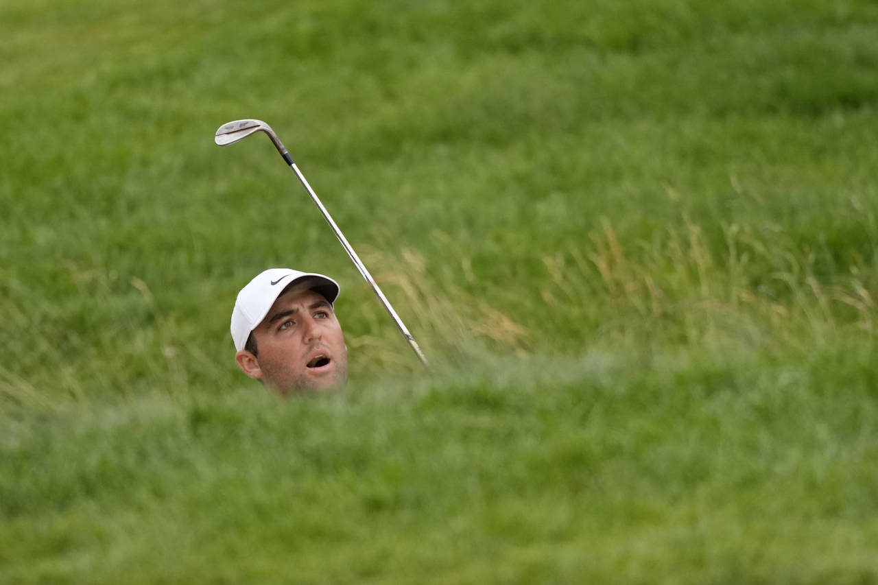 Scottie Scheffler watches his shot on the fifth hole during the final round of the U.S. Open golf t...