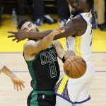 
              Boston Celtics forward Jayson Tatum (0) is defended by Golden State Warriors forward Draymond Green during the second half of Game 5 of basketball's NBA Finals in San Francisco, Monday, June 13, 2022. (AP Photo/John Hefti)
            