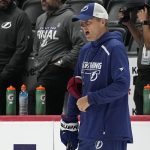 
              Tampa Bay Lightning head coach Jon Cooper speaks to his players during NHL hockey practice, Friday, June 17, 2022, in Denver. (AP Photo/John Locher)
            