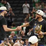 
              Golden State Warriors guard Stephen Curry, right and Golden State Warriors guard Klay Thompson celebrate after defeating the Boston Celtics in Game 6 to win basketball's NBA Finals, Thursday, June 16, 2022, in Boston. (AP Photo/Steven Senne)
            