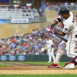 
              Minnesota Twins Luis Arraez swings into a three-run homer against the Cleveland Guardians in the seventh inning of a baseball game Tuesday, June 21, 2022, in Minneapolis. (AP Photo/Andy Clayton-King)
            